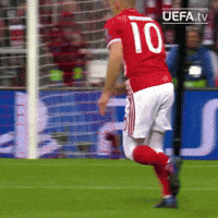 a soccer player wearing a red jersey with the number 10 on it