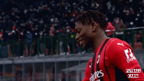 A Soccer Player Wearing A Red Jersey With The Number 14 On It GIF