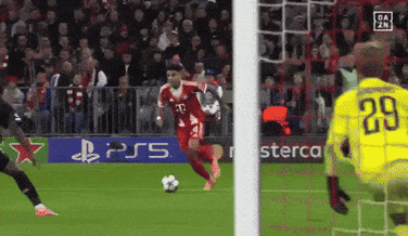 A Soccer Player Wearing A Red Jersey With The Number 21 On It GIF