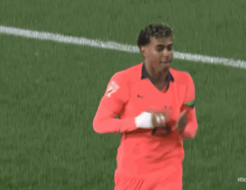 A Soccer Player Wearing A Red Jersey With The Number 27 On It Is Running On The Field . GIF