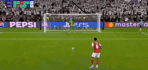 A Soccer Player Wearing A Red Jersey With The Number 6 On It Is About To Kick The Ball Into The Goal . GIF