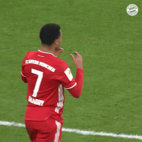 A Soccer Player Wearing A Red Jersey With The Number 7 On The Back GIF