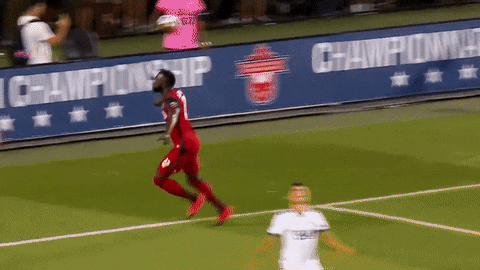 A Soccer Player Wearing A Red Jersey With The Number 8 On It GIF