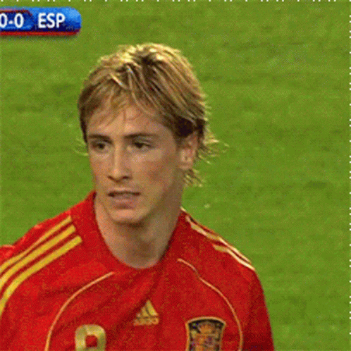 A Soccer Player Wearing A Red Jersey With The Number 9 GIF