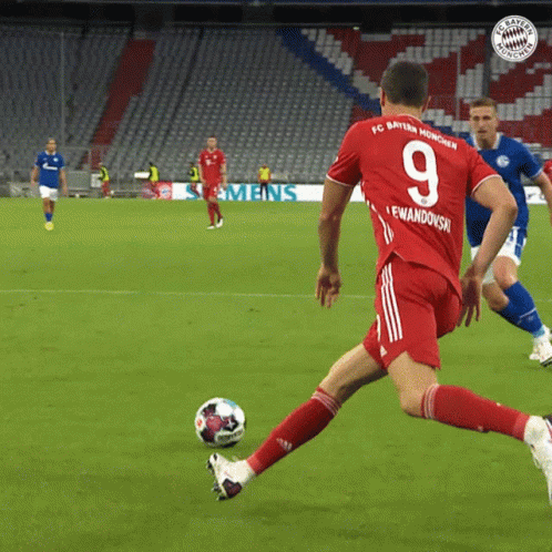 A Soccer Player Wearing A Red Jersey With The Number 9 On It GIF