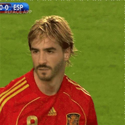 A Soccer Player Wearing A Red Jersey With The Number 9 GIF