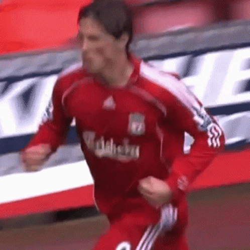 A Soccer Player Wearing A Red Jersey With The Word Carlsberg On It GIF