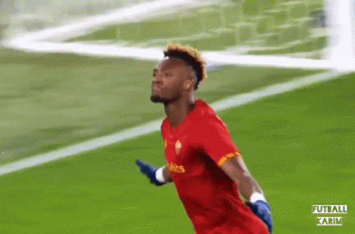 A Soccer Player Wearing A Red Shirt That Says ' Falcons ' On It GIF