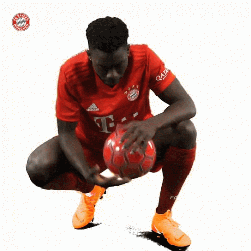 A Soccer Player Wearing A Red Shirt With The Letter T On The Front GIF