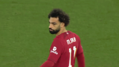 A Soccer Player Wearing A Red Shirt With The Number 11 On The Back GIF