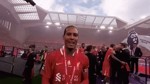 A Soccer Player Wearing A Red Shirt With The Word Liverpool On It GIF