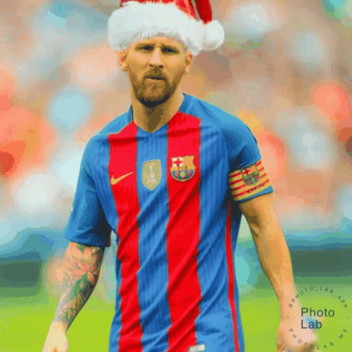 A Soccer Player Wearing A Santa Hat And A Fc Barcelona Shirt GIF