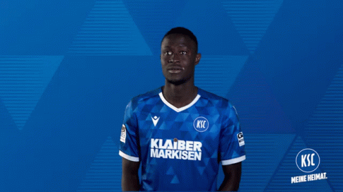 A Soccer Player Wearing A Shirt That Says Klarer Marksen GIF