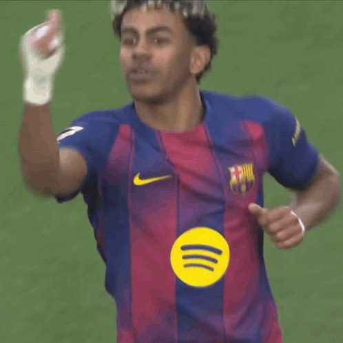 A Soccer Player Wearing A Shirt With A Spotify Logo On It GIF