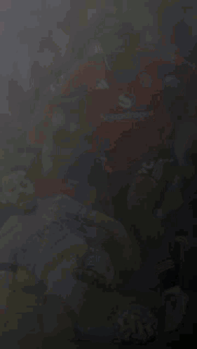 A Soccer Player Wearing A Snapdragon Jersey Is Playing Soccer With Another Player GIF