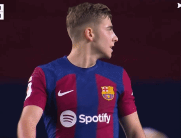 A Soccer Player Wearing A Spotify Shirt Looks To His Left GIF