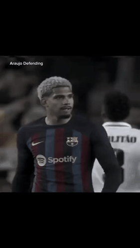 A Soccer Player Wearing A Spotify Shirt Salutes The Crowd GIF