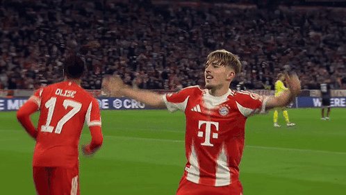 A Soccer Player Wearing A T-Mobile Jersey Celebrates A Goal GIF