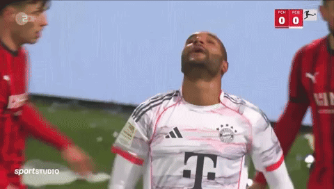 a soccer player wearing a t-mobile jersey is celebrating