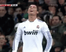 A Soccer Player Wearing A White Bwin Jersey Is Laughing GIF