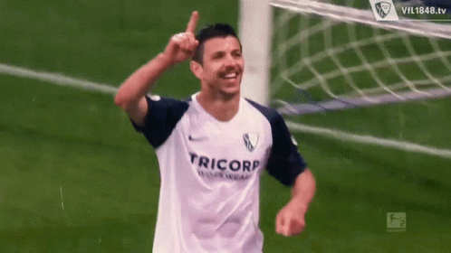 a soccer player wearing a white jersey that says rico on it