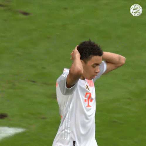 A Soccer Player Wearing A White Jersey With A Red T On It GIF