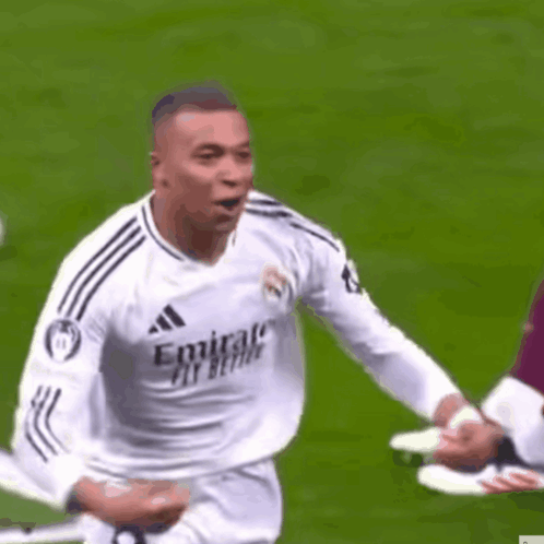 A Soccer Player Wearing A White Jersey With Emirates Fly Better On It Is Running On A Field . GIF