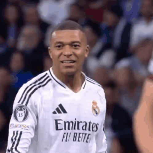 A Soccer Player Wearing A White Jersey With Emirates Fly Better On It GIF