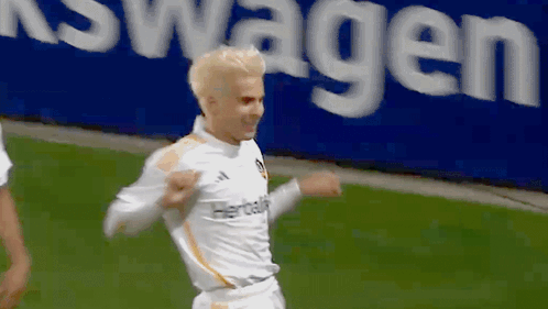 A Soccer Player Wearing A White Jersey With Herbalife On It GIF