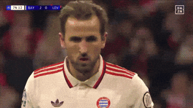 A Soccer Player Wearing A White Jersey With Red Stripes Looks At The Camera During A Game Between Bay And Lev GIF