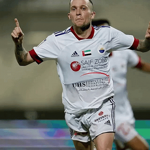 A Soccer Player Wearing A White Jersey With Safe Zone Written On It GIF