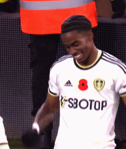 A Soccer Player Wearing A White Jersey With Sbotop Written On It GIF