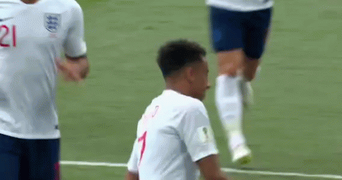 A Soccer Player Wearing A White Jersey With The Number 1 On It Is Standing On A Soccer Field . GIF