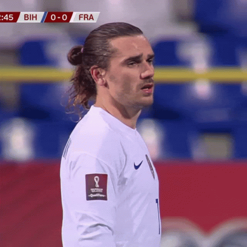 A Soccer Player Wearing A White Jersey With The Number 1 On The Front GIF