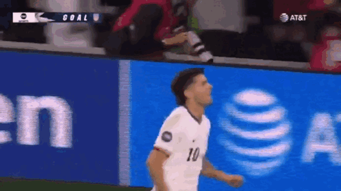 A Soccer Player Wearing A White Jersey With The Number 10 On It GIF