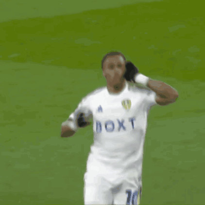A Soccer Player Wearing A White Jersey With The Number 10 On The Back GIF