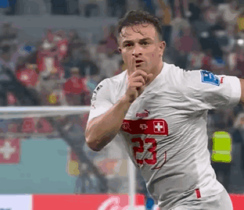 A Soccer Player Wearing A White Jersey With The Number 23 GIF