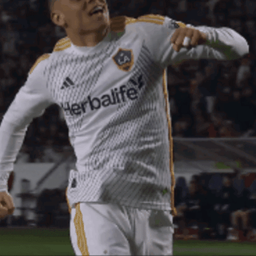 A Soccer Player Wearing A White Jersey With The Word Herbalife On It GIF