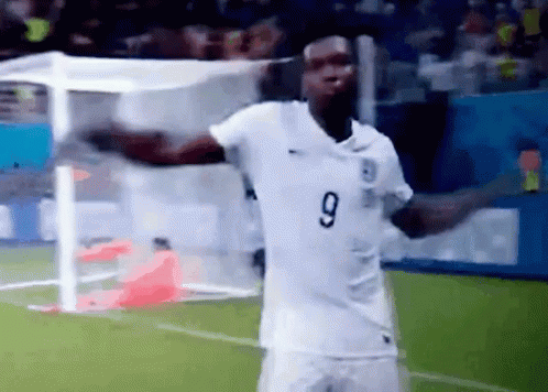 A Soccer Player Wearing A White Number 9 Jersey GIF