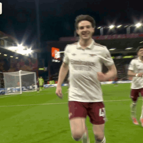 A Soccer Player Wearing A White Shirt That Says Emirates GIF