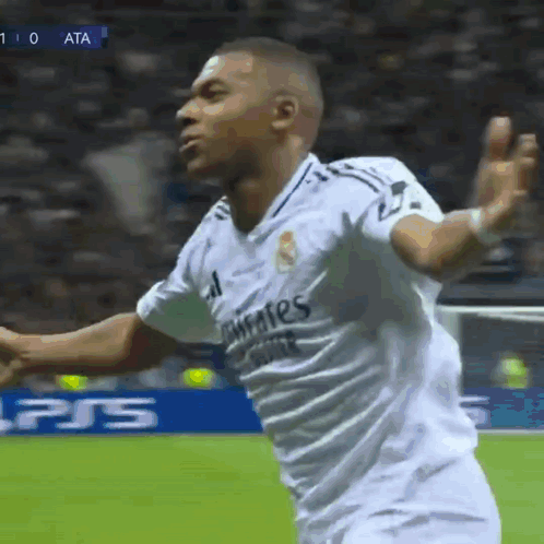 A Soccer Player Wearing A White Shirt That Says Fly Emirates GIF