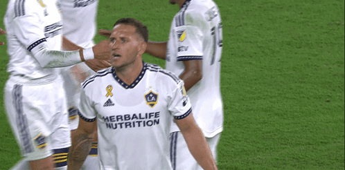 A Soccer Player Wearing A White Shirt That Says Herbalife Nutrition On It GIF