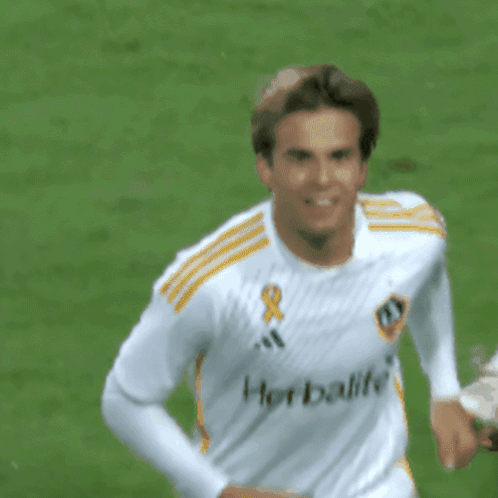 A Soccer Player Wearing A White Shirt That Says Herbalife On It GIF