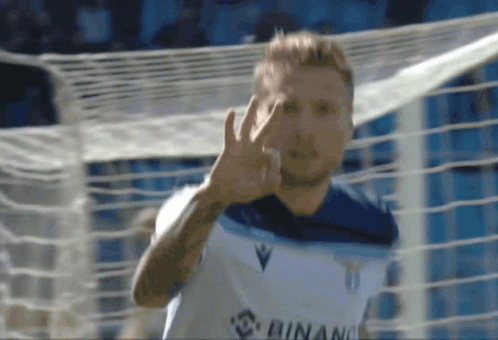 A Soccer Player Wearing A White Shirt That Says ' Runa ' On It GIF