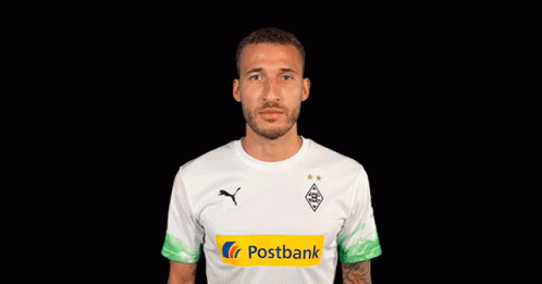 A Soccer Player Wearing A White Shirt With A Postbank Logo On It GIF