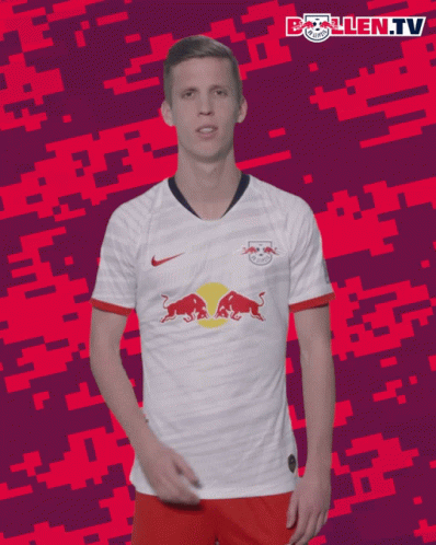 A Soccer Player Wearing A White Shirt With A Red Bull On It GIF