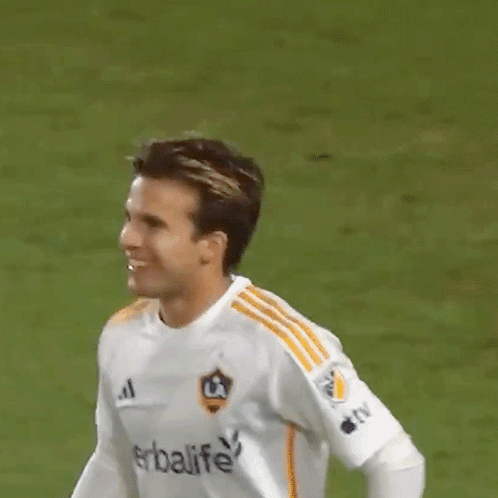A Soccer Player Wearing A White Shirt With Herbalife On It GIF