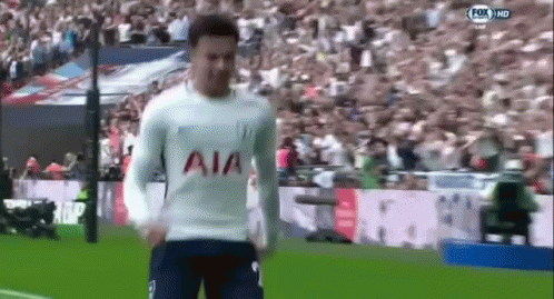 A Soccer Player Wearing A White Shirt With The Word Aia On It Is Running On A Field . GIF