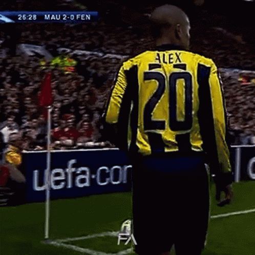 A Soccer Player Wearing A Yellow And Black Jersey With The Number 20 On It GIF