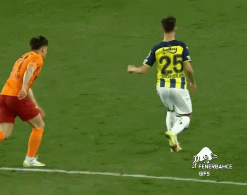A Soccer Player Wearing A Yellow And Blue Jersey With The Number 25 GIF